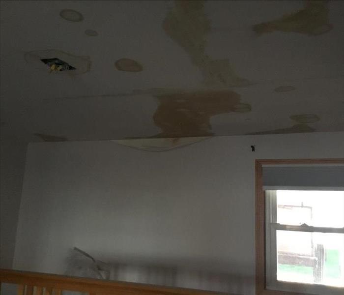 Ceiling with water damage and light fixture removed 