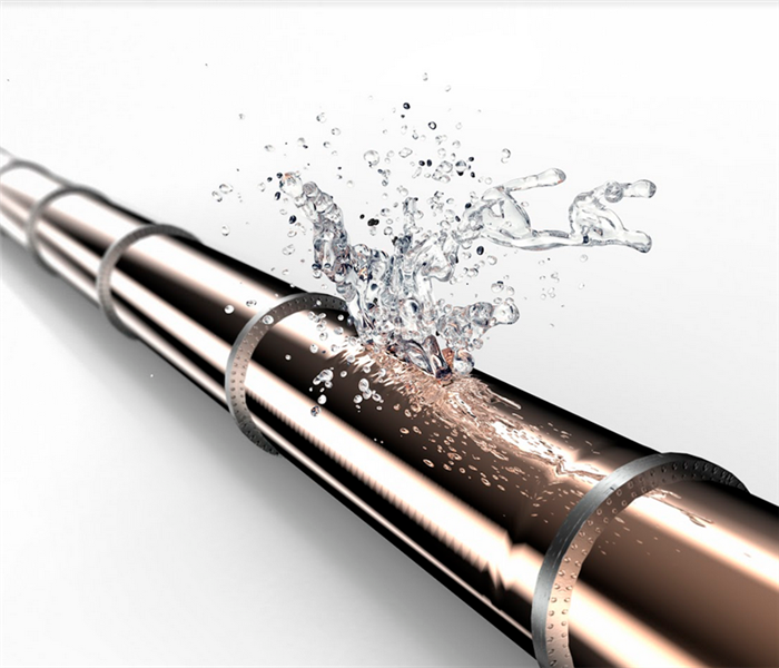 a broken stainless steel pipe with water leaking from it