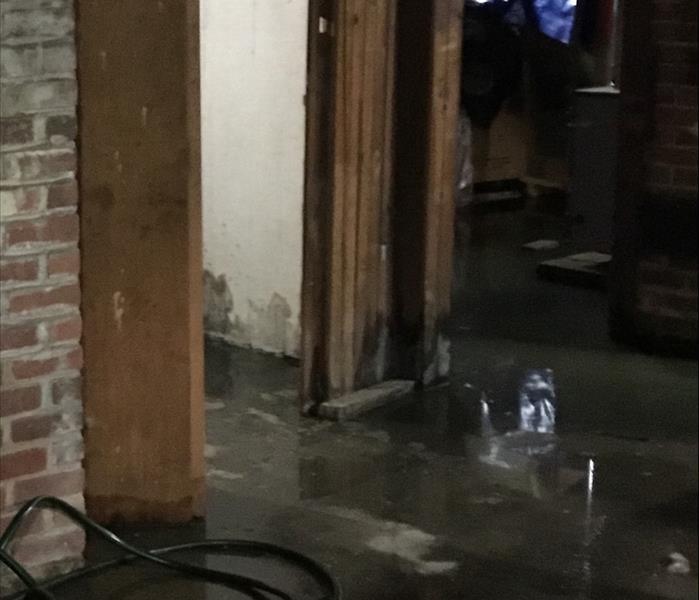 basement flooding and sewage problem brick wall